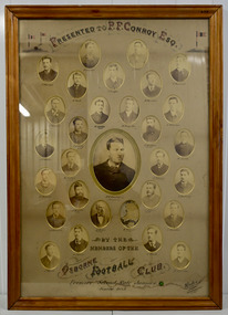 A photograph of the Osborne Football Team Williamstown, part of the Victorian Junior Football Association 1885, the year they won the premiership.  It comprises 29 small, sepia individual photographs arranged around a larger photograph of a thirtieth member of the team, P.F. Conroy to whom the framed photograph was presented. One photograph is missing from its place. The photograph has been framed in a wooden frame under glass.