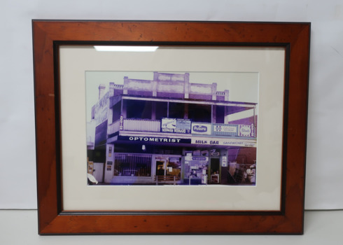Coloured photograph of an optometrist and milk bar in Ferguson St Williamstown
