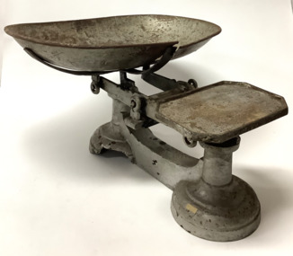 Large vintage cast iron balance scales with a removable weighing bowl. The scales have been painted with silver paint.