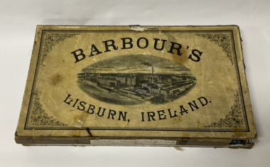 Cardboard box containing a variety of Barbours linen and silk thread 