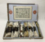 Lidded cardboard box containing a variety of silk and linen sewing thread. The tread is sorted in to hanks, ans grouped into seven small cardboard boxes. The inside of the lid shows drawings of a range of products made by the company.