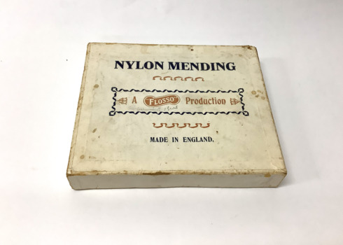 Lidded cardboard box containing 92 cards of coloured nylon mending thread for stockings 