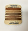 A card of coloured nylon mending thread for stockings 