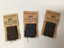 Front view of three Myerson suit or costume fabric samplers: small fabric samples stapled to a cardboard card. 