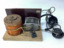 Vintage crystal radio set, home made, on a wooden stand; consisting of a coil (inductor); a tuning capacitor for selection of AM radio stations; headphones manufactured in Japan in the 1950's.