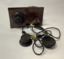 Vintage crystal radio set, home made, on a wooden stand; consisting of a coil (inductor); a tuning capacitor for selection of AM radio stations; headphones manufactured in Japan in the 1950's.