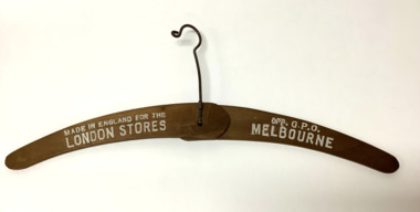 Folding wooden coathanger with a twisted wire hook, from the London Stores, Melbourne.