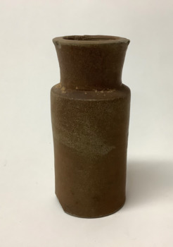 Stoneware ink bottle. Wide mouthed and originally had a brown salt glaze.