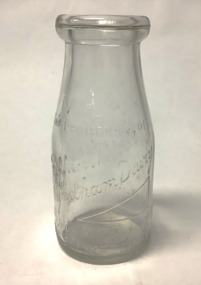 Clear glass milk bottle, 10 ozs. (283.5 grams) capacity,  with embossed information, from Griffiths dairy Williamstown.