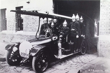 Photograph - Melbourne Fire Brigade - Fire Engine and Williamstown members aboard leaving the station entrance