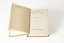 This is a small sized book in a solid orange colour hardback. There is text in gold on the front and spine that reads: Wilfred C. Busse / The Golden Plague / 