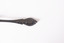 Rear view of teaspoon with tarnished patina. 