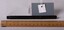 A solid and complete black patterned fountain pen. Measurement ruler and object label are also present.