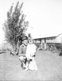 Photograph, Captain Maddigan and child