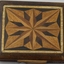Handmade wooden cigarette box with inlay top and bottom, one corner missing (broken)