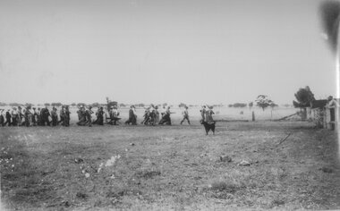 Photograph, marching across paddocks, 1940