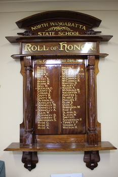 Large solid timber Honour Board with two carved minature cannons on top and above side columns.