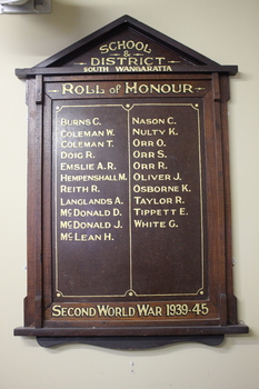 Timber Honour Board with  two columns consisting of twenty one names in gold paint.