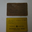Brown cloth covered booklet with black writing and crest in the middle of the cover.