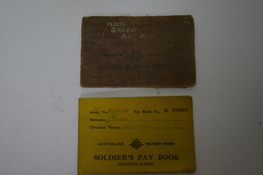 Brown cloth covered booklet with black writing and crest in the middle of the cover.