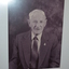 Dark timber framed containing photograph of Life Member - Frank RAMAGE