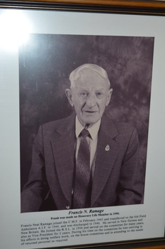 Dark timber framed containing photograph of Life Member - Frank RAMAGE