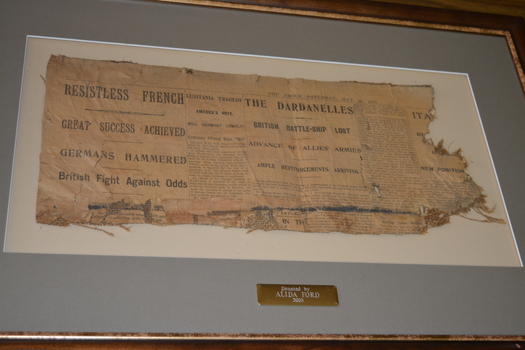 Framed newspaper article from The Argus dated May 15, 1915