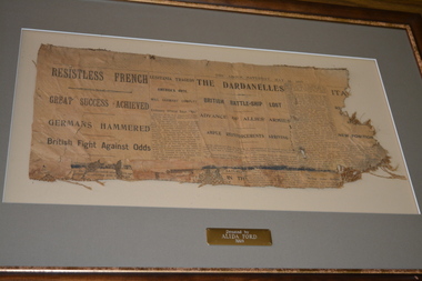 Framed newspaper article from The Argus dated May 15, 1915