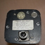 Aircraft Gyro Horizon Indicator - silver metal instrument comprising of multiple parts housed in black metal oblong unit.