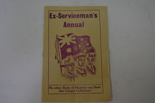 Yellow covered book with maroon coloured writings of images of three servicemen beneath flag of Australia 