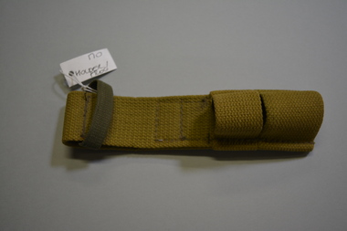 Pale khaki canvas type material bayonet holder, also known as a Frog.  Has a large darker khaki loop at the top and two smaller canvas loops at the bottom.