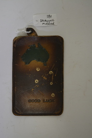 Brown leather pouch contains a silver piece of metal used as a shaving mirror.