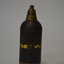 Brown metal round in shape with pointed top features original paint with a yellow band on body and a red band at the top. 