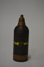 Brown metal round in shape with pointed top features original paint with a yellow band on body and a red band at the top. 