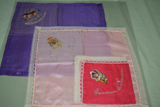 Three machine embroided silk handkerchiefs - purple, light pink and bright pink in colour