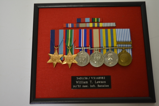Black timber frame with six Medals and ribbons together with plaque mounted on red felt