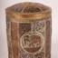 Round metal container with fitted lid ornately engraved with elephants