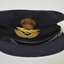 Dark blue felt RAAF Officer’s hat with emblem/crown above wings at front above peak.