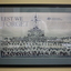 Black plastic frame with grey mount containing poster/photograph of Navy crew on ship and in foreground. 
