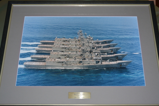 Five grey RAN class 7 frigates side by side at sea