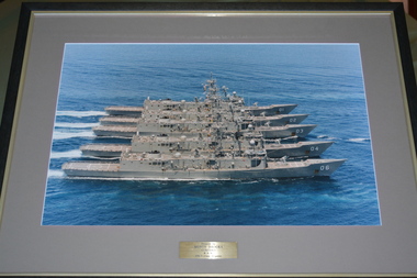 Five grey RAN class 7 frigates side by side at sea