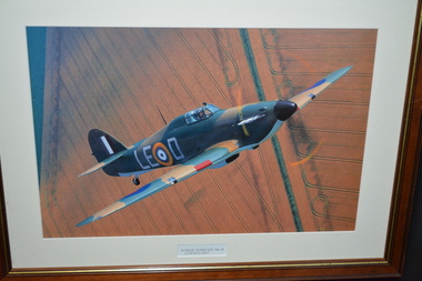 Framed colour print of aircraft flying over agricultural land