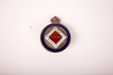 Round bronze and enamel badge badge with blue circular border enclosing a white and red diamond. Crown on top.