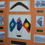 Large  timber frame with orange mount containing boomerang three flags six photographs and narrative plaques