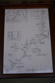 Brown timber frame containing  black and white map.  Has two squares top left side and lower half contains three circles.