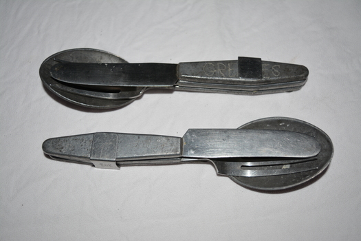 Silver metal Spoon Knife and Fork set held together by attached metal clip