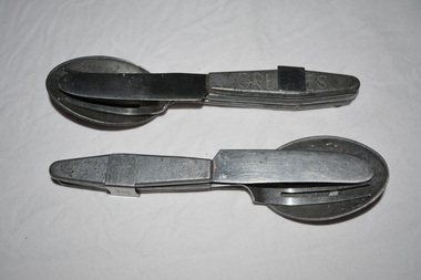 Silver metal Spoon Knife and Fork set held together by attached metal clip