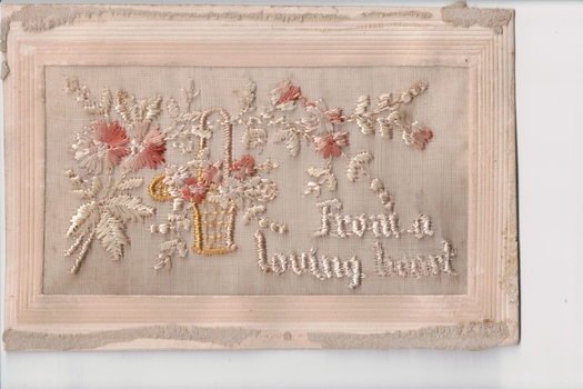 White rectangular postcard with embroidered beige, brown and yellow flower and foliate decoration on front.  