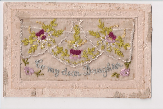White rectangular postcard with embroidered pink, purple flowers green foliate decoration on front.