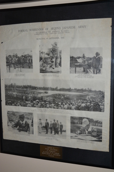Black plastic frame containing photocopy of 7 photographs on cream coloured paper document on  black mount.